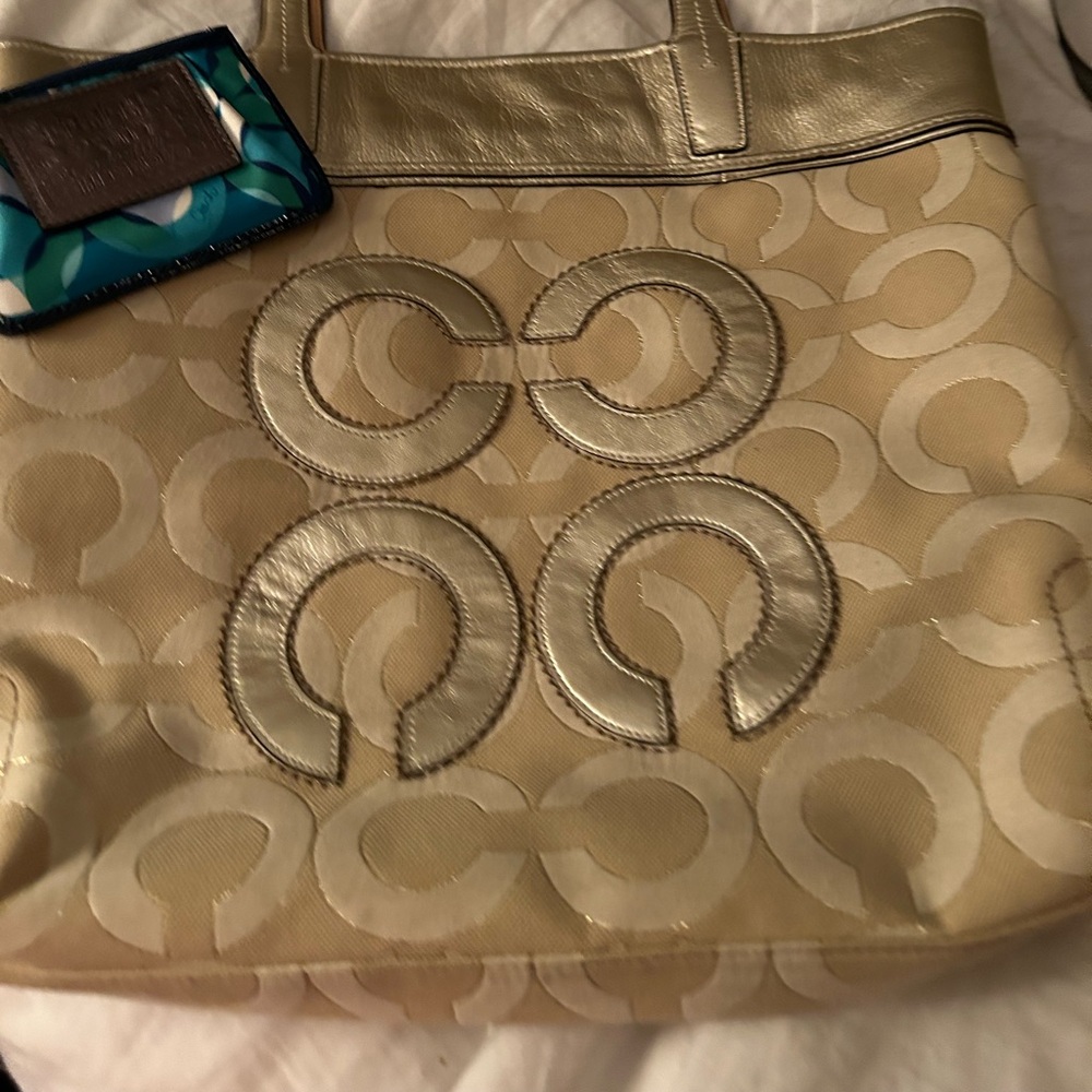 Coach Gold signature canvas satchel and blue “poppy” card and key pouch.